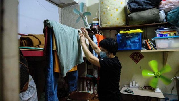 Wong seen drying clothes in her flat. On paper, Hong Kong is one of the richest cities in the world. But it suffers from pervasive inequality, an acute housing shortage and eye-watering rents that successive governments have failed to solve, reported AFP. (Anthony Wallace / AFP) Wong seen drying clothes in her flat. On paper, Hong Kong is one of the richest cities in the world. But it suffers from pervasive inequality, an acute housing shortage and eye-watering rents that successive governments have failed to solve, reported AFP. (Anthony Wallace / AFP)