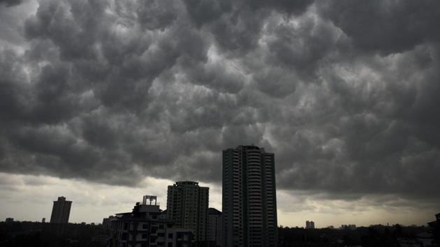 Rain clouds gather above the city skyline in Kochi, Kerala. (AP) Rain clouds gather above the city skyline in Kochi, Kerala. (AP)