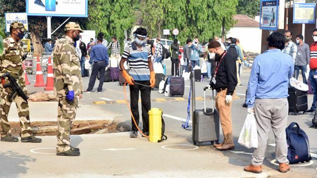 A worker sanitizes luggage brought in by employees of Oil and Natural Gas Corporation (ONGC) who were being taken via a special charter flight to Mumbai High Oilfield, from Jay Prakash Narayan International Airport, in Patna, Bihar. (Parwaz Khan /HT PHOTO) A worker sanitizes luggage brought in by employees of Oil and Natural Gas Corporation (ONGC) who were being taken via a special charter flight to Mumbai High Oilfield, from Jay Prakash Narayan International Airport, in Patna, Bihar. (Parwaz Khan /HT PHOTO)