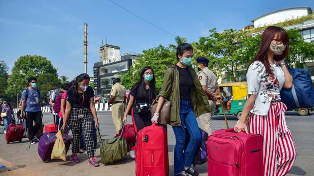 Stranded people from northeast India, arrive at the Palace Ground for registration to board a special train from Malur Station for Guwahati, Assam to reach their native places, amid ongoing Covid-19 lockdown, in Bengaluru. (PTI)