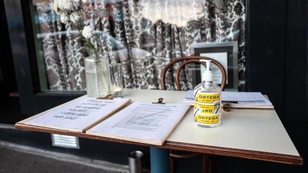 A bottle of hand sanitizer seen on a table outside the Ortega Fish Shack restaurant in Wellington. (Birgit Krippner / Bloomberg) A bottle of hand sanitizer seen on a table outside the Ortega Fish Shack restaurant in Wellington. (Birgit Krippner / Bloomberg)