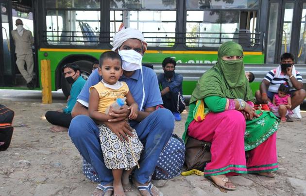 Migrant families wait for registration for special trains to their native places, at the inter-state bus terminal in Sector 43, Chandigarh.(Ravi Kumar/HT) Migrant families wait for registration for special trains to their native places, at the inter-state bus terminal in Sector 43, Chandigarh.(Ravi Kumar/HT)
