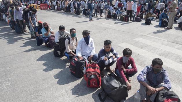 Migrant workers from other states wait at a railway station in Mumbai to board trains to reach home.(Satyabrata Tripathy/HT Photo) Migrant workers from other states wait at a railway station in Mumbai to board trains to reach home.(Satyabrata Tripathy/HT Photo)