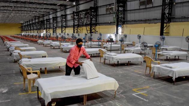 Workers prepare a quarantine centre for Covid-19 patients at Bombay Exhibition Centre during the nationwide lockdown in wake of the coronavirus pandemic.(PTI File Photo)