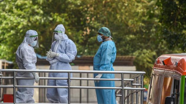 Medical workers in PPE gear seen outside the Covid-19 ward, at Lok Nayak Jai Prakash Narayan Hospital (LNJP) in New Delhi. (Biplov Bhuyan/HT PHOTO) Medical workers in PPE gear seen outside the Covid-19 ward, at Lok Nayak Jai Prakash Narayan Hospital (LNJP) in New Delhi. (Biplov Bhuyan/HT PHOTO)