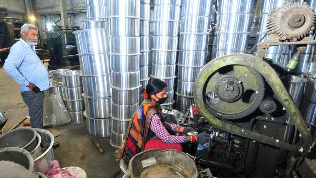 Labourers work in a utensil manufacturing factory at Micro, Small and Medium Enterprises (MSME) unit.(ANI)