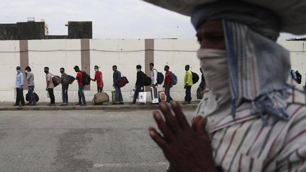 Migrant workers from other states wait in a queue outside a railway station in Mumbai to catch a train to return to their homes on May 15. The number of Covid-19 in India on May 15 crossed China, where the disease originated late last year. India had inched past 86,500 cases as of this afternoon according to covid19india.org. (Rafiq Maqbool / AP) Migrant workers from other states wait in a queue outside a railway station in Mumbai to catch a train to return to their homes on May 15. The number of Covid-19 in India on May 15 crossed China, where the disease originated late last year. India had inched past 86,500 cases as of this afternoon according to covid19india.org. (Rafiq Maqbool / AP)