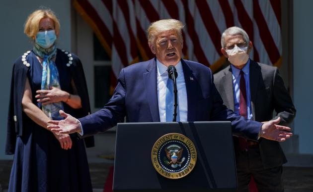 US President Donald Trump speaks about administration efforts to develop a novel coronavirus vaccine as Dr. D Birx, White House Covid-19 response coordinator, and NIAID Director Dr. A Fauci listen during a Covid-19 pandemic response event in the Rose Garden at the White House in Washington, US.(REUTERS) US President Donald Trump speaks about administration efforts to develop a novel coronavirus vaccine as Dr. D Birx, White House Covid-19 response coordinator, and NIAID Director Dr. A Fauci listen during a Covid-19 pandemic response event in the Rose Garden at the White House in Washington, US.(REUTERS)