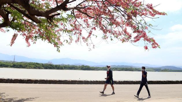 Walkers at Sukhna Lake in Chandigarh during last day of third phase of nationwide lockdown in Chandigarh on Sunday. With summer turning the heat up, morning and evening walkers in Chandigarh want the relaxation hours to begin earlier in the day and extend to a longer period till late in the evening.(Sanjeev Sharma /HT) Walkers at Sukhna Lake in Chandigarh during last day of third phase of nationwide lockdown in Chandigarh on Sunday. With summer turning the heat up, morning and evening walkers in Chandigarh want the relaxation hours to begin earlier in the day and extend to a longer period till late in the evening.(Sanjeev Sharma /HT)