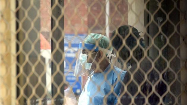 A doctors in PPE overalls as they collect swabs samples for Covid-19 testing at LNJP Hospital, during nationwide lockdown to curb the spread of coronavirus, in New Delhi. (Sonu Mehta/HT PHOTO) A doctors in PPE overalls as they collect swabs samples for Covid-19 testing at LNJP Hospital, during nationwide lockdown to curb the spread of coronavirus, in New Delhi. (Sonu Mehta/HT PHOTO)