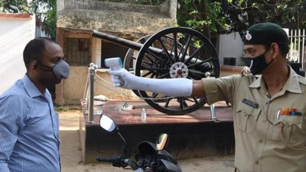 A Military Police personnel using a thermal screening device outside BMP-5 after several Bihar Military Police personnel tested coronavirus positive, in Patna, Bihar, India on Wednesday, May 13, 2020. (Santosh Kumar/ Hindustan Times) A Military Police personnel using a thermal screening device outside BMP-5 after several Bihar Military Police personnel tested coronavirus positive, in Patna, Bihar, India on Wednesday, May 13, 2020. (Santosh Kumar/ Hindustan Times)
