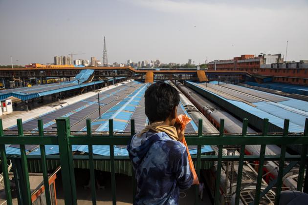 A man looks at train coaches parked in New Delhi Railway Station. With a combination of several reforms, fiscal and liquidity measures, finance minister Nirmala Sitharaman today completed the announcement of the last leg of the ₹20 lakh crore economic package. (Prashanth Vishwanathan / Bloomberg)