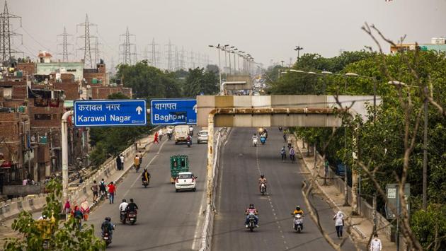 Vehicles travel a road in the Bhajanpura area during lockdown. India will open up its space facilities, mineral blocks and power distribution to private companies, as it seeks new investments to help shore up an economy hit by the coronavirus pandemic. (Prashanth Vishwanathan / Bloomberg)