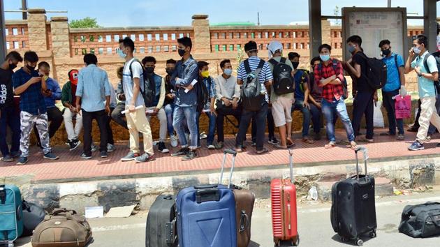Students and other migrants from Manipur stand in a queue to board the bus to reach Malur and Chikkabanavara Railway Station to travel to their native places during the ongoing lockdown, in Bengaluru on May 15. (ANI) Students and other migrants from Manipur stand in a queue to board the bus to reach Malur and Chikkabanavara Railway Station to travel to their native places during the ongoing lockdown, in Bengaluru on May 15. (ANI)