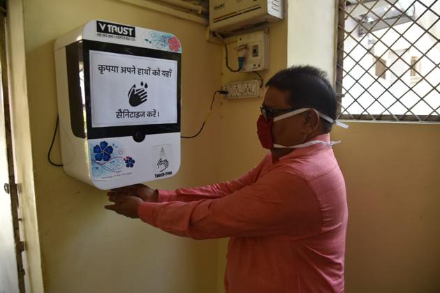 An automated sanitiser machine at the UP BJP office in Lucknow.(HT Photo)
