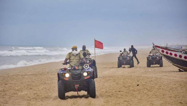 Marine police personnel patrol Puri beach to prevent tourists and fishermen from venturing into the sea due to Cyclone Amphan, in Puri, Sunday, May 17, 2020.(PTI)