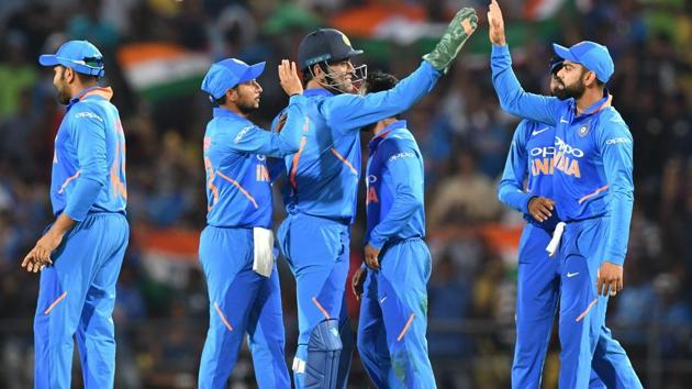 (FILES) In this file photo taken on March 5, 2019, Indian cricket team captain Virat Kohli (R) celebrates with Mahendra Singh Dhoni (C) and teammates (AFP) (FILES) In this file photo taken on March 5, 2019, Indian cricket team captain Virat Kohli (R) celebrates with Mahendra Singh Dhoni (C) and teammates (AFP)