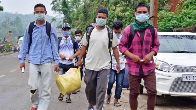 Migrant workers walk on the road to reach their villages during extended coronavirus lockdown to slow the spread of the coronavirus, on the outskirts of Guwahati on May 6.(ANI) Migrant workers walk on the road to reach their villages during extended coronavirus lockdown to slow the spread of the coronavirus, on the outskirts of Guwahati on May 6.(ANI)