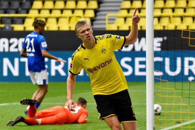 Dortmund's Erling Braut Haaland celebrates scoring their first goal as play resumes behind closed doors following the outbreak of the coronavirus disease (COVID-19). (REUTERS)