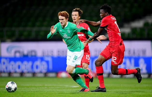 Leverkusen's Edmond Tapsoba in action with Werder Bremen's Joshua Sargent. (REUTERS)