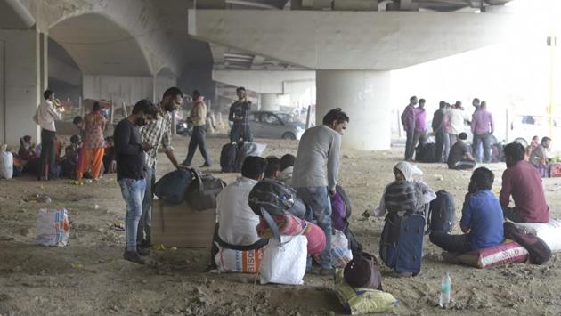 Migrants break for rest under a flyover after being stopped from entering Uttar Pradesh on foot by Delhi police, at Ghazipur Delhi-UP border, in New Delhi on Monday, May 18, 2020. (Photo by Sushil Kumar/Hindustan Times) Migrants break for rest under a flyover after being stopped from entering Uttar Pradesh on foot by Delhi police, at Ghazipur Delhi-UP border, in New Delhi on Monday, May 18, 2020. (Photo by Sushil Kumar/Hindustan Times)