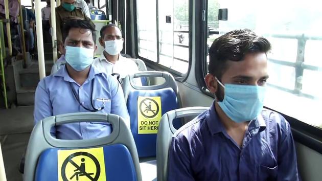 In addition to marshals, Delhi Transport Corporation bus services resumed with a maximum capacity of 20 passengers at a time, one passenger per row and all passengers seated in a zigzag pattern. (ANI)