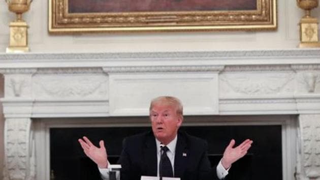 US President Donald Trump talks about taking daily doses of hydroxychloroquine pills as he addresses a meeting on Covid-19 with restaurant executives and industry leaders at the White House in Washington, on May 18. (Reuters Photo)