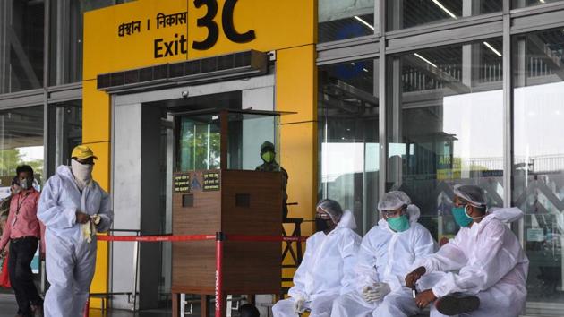 According to the passengers, there were eight pregnant women, who just couldn’t stand for long and had to sit on the ground. They wanted to use the washroom but were denied permission to leave the tarmac by the security forces manning the area. (Photo by Samir Jana / Hindustan Times)