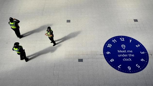 Police officers are seen in Waterloo station during the morning rush hour following the outbreak of the coronavirus disease (COVID-19), London, Britain, May 19, 2020. (REUTERS)