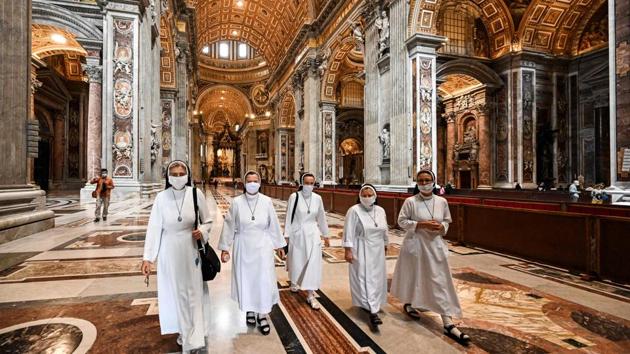 Nuns visit St. Peter’s Basilica as it opened on May 18 in Vatican City. As with all social gatherings, public masses had also been restricted. They have now been allowed again in churches, but congregations must follow social distancing guidelines. (Vincenzo Pinto / AFP)