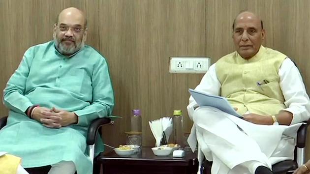 Union home minister Amit Shah sitting with defence minister Rajnath Singh(ANI file photo)