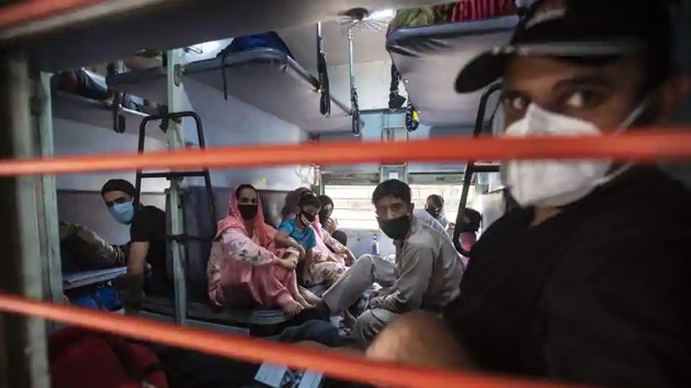 Stranded people sit inside a railway compartment before the train towards Jammu and Kashmir leaves from Pune railway station, India, on May 19, 2020. (Pratham Gokhale/HT Photo) Stranded people sit inside a railway compartment before the train towards Jammu and Kashmir leaves from Pune railway station, India, on May 19, 2020. (Pratham Gokhale/HT Photo)