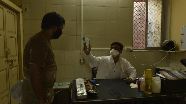 Mumbai, India - 18 May 2020: BMC clinic doctor doing thermal checking at BMC clinic, Worli Village in Mumbai, India, on Monday, May 18, 2020. (Photo by Pramod Thakur/ Hindustan Times) (Hindustan Times) Mumbai, India - 18 May 2020: BMC clinic doctor doing thermal checking at BMC clinic, Worli Village in Mumbai, India, on Monday, May 18, 2020. (Photo by Pramod Thakur/ Hindustan Times) (Hindustan Times)