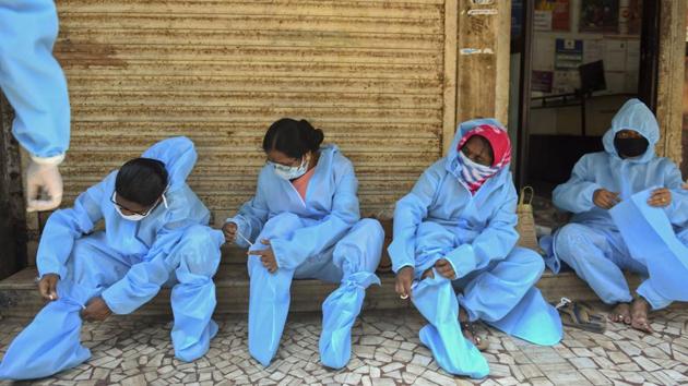 Health care workers wearing Personal Protective Equipment (PPE) to check patients at Dharavi during a government-imposed nationwide lockdown as a preventive measure against the COVID-19 in Mumbai, India, on Thursday, May 14, 2020. (Satish Bate/HT Photo) Health care workers wearing Personal Protective Equipment (PPE) to check patients at Dharavi during a government-imposed nationwide lockdown as a preventive measure against the COVID-19 in Mumbai, India, on Thursday, May 14, 2020. (Satish Bate/HT Photo)