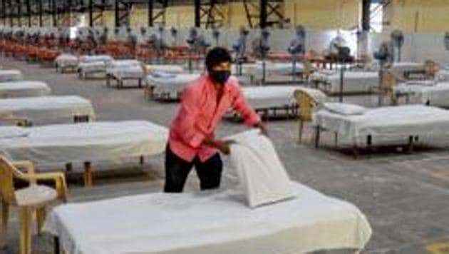 Workers prepare a quarantine centre for Covid-19 patients at Bombay Exhibition Centre during the nationwide lockdown in wake of the coronavirus pandemic in Mumbai. (PTI File Photo) Workers prepare a quarantine centre for Covid-19 patients at Bombay Exhibition Centre during the nationwide lockdown in wake of the coronavirus pandemic in Mumbai. (PTI File Photo)