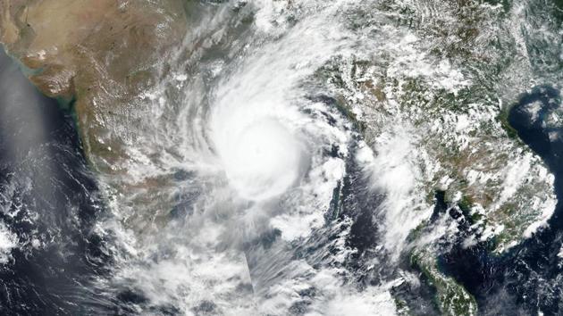 A satellite image released by NASA shows Cyclone Amphan over the Bay of Bengal in India. According to the India Meteorological Department (IMD), Amphan is expected to make landfall between Digha in West Bengal and Hatiya Island in Bangladesh, close to the Sundarbans and around Sagar Island as a very severe cyclonic storm. (NASA / AP / PTI) A satellite image released by NASA shows Cyclone Amphan over the Bay of Bengal in India. According to the India Meteorological Department (IMD), Amphan is expected to make landfall between Digha in West Bengal and Hatiya Island in Bangladesh, close to the Sundarbans and around Sagar Island as a very severe cyclonic storm. (NASA / AP / PTI)
