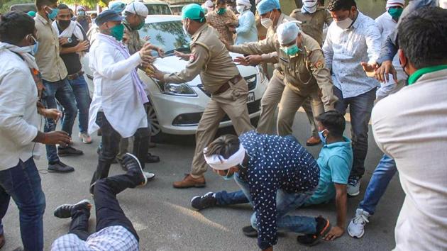 Supporters of Uttar Pradesh Congress chief, Ajay Kumar Lallu, try to block the way after the former was arrested by a team of Lucknow police. (PTI Photo) Supporters of Uttar Pradesh Congress chief, Ajay Kumar Lallu, try to block the way after the former was arrested by a team of Lucknow police. (PTI Photo)