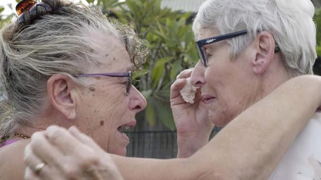 Christine Archer, right, and her sister Gail Baker cry as they are reunited in Bowraville, Australia. (PTI Photo) Christine Archer, right, and her sister Gail Baker cry as they are reunited in Bowraville, Australia. (PTI Photo)