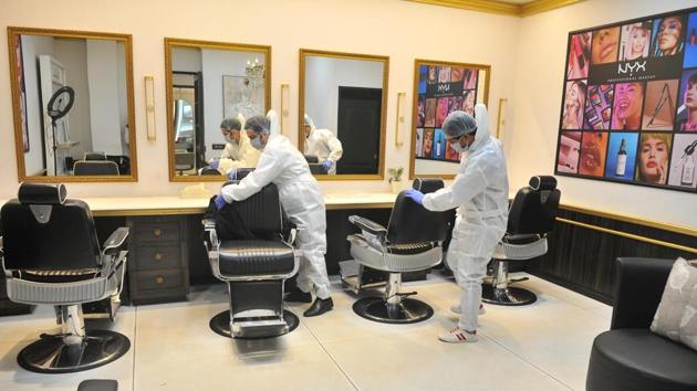 Workers sanitising saloon in Sector 8 in Chandigarh on Wednesday. The administration is considering allowing opening of salons and barber shops in the next couple of days. (Ravi Kumar/HT) Workers sanitising saloon in Sector 8 in Chandigarh on Wednesday. The administration is considering allowing opening of salons and barber shops in the next couple of days. (Ravi Kumar/HT)