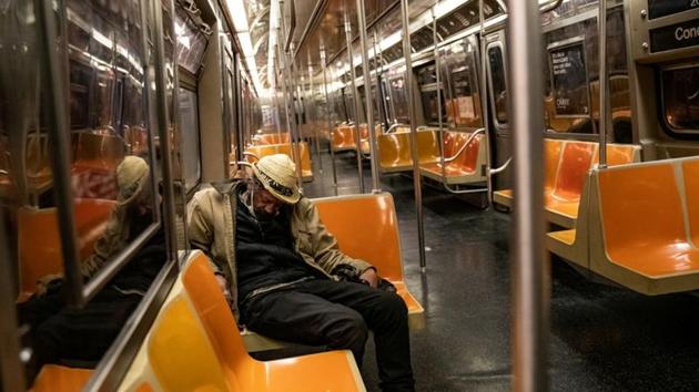 A passenger sleeps inside an MTA subway car, during the outbreak of the coronavirus disease in New York City, in this file photo. (Reuters Photo) A passenger sleeps inside an MTA subway car, during the outbreak of the coronavirus disease in New York City, in this file photo. (Reuters Photo)