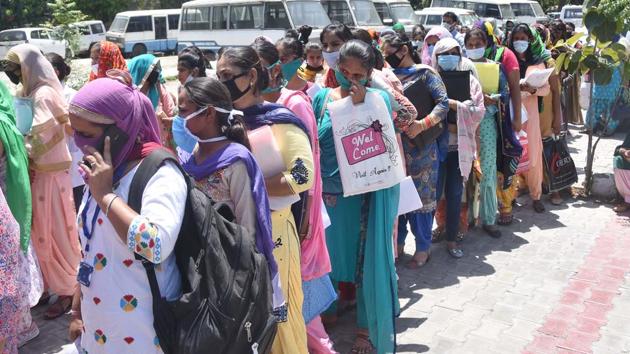 Volunteers queuing up at the civil surgeon’s office to register themselves for work at Covid isolation centres in Ludhiana on Wednesday.(Gurpreet Singh/HT)