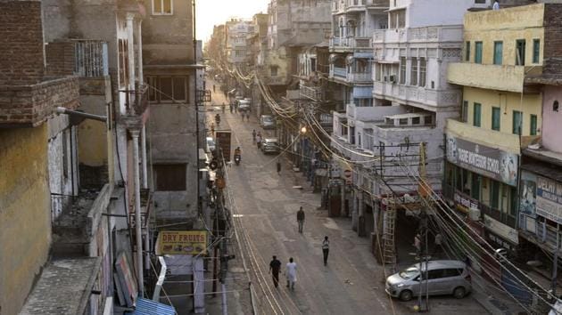 The bylanes of Katra Neel in Sadar Bazar wear a deserted look on May 19. “I was never short of work since I came to Sadar Bazar 22 years ago. Starting at 10 am, I would work late into the night, earning anything between ₹400 to ₹800 a day. I have waited for 2 months and I think I should wait for some more time before I leave,” Mallu Singh, 40, a labourer told HT. Singh hails from Gonda district in Uttar Pradesh. (Vipin Kumar / HT Photo)