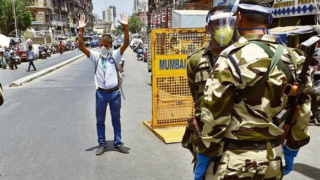 CISF personnel punish a biker for violating lockdown norms at Bhendi Bazaar, Mumbai, on Thursday. (PTI file photo) CISF personnel punish a biker for violating lockdown norms at Bhendi Bazaar, Mumbai, on Thursday. (PTI file photo)