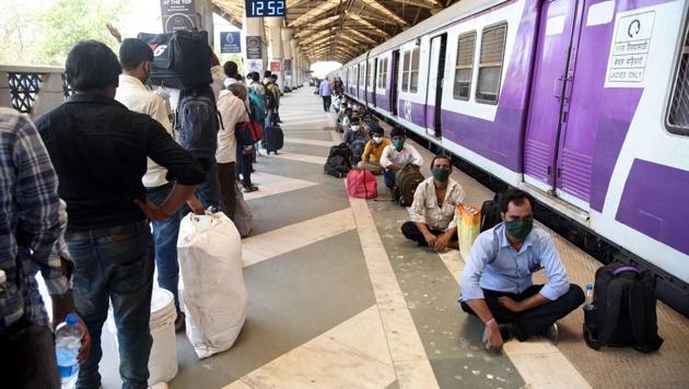 Migrants in queue departs for Lucknow from Panvel Railway Station by Shramik Special Train during Nationwide Lockdown in the wake of Coronavirus pandemic at Panvel Railway Station in in Navi Mumbai, India, on Wednesday, May 20, 2020. (Photo by Bachchan Kumar/Hindustan Times) Migrants in queue departs for Lucknow from Panvel Railway Station by Shramik Special Train during Nationwide Lockdown in the wake of Coronavirus pandemic at Panvel Railway Station in in Navi Mumbai, India, on Wednesday, May 20, 2020. (Photo by Bachchan Kumar/Hindustan Times)