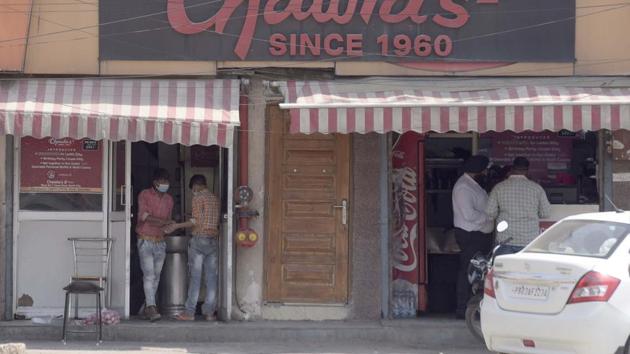 A view of open restaurant at Aarti chowk, they are only allow for home delivery in Ludhiana on Saturday, May 09, 2020. (Gurpreet Singh/Hindustan Times) A view of open restaurant at Aarti chowk, they are only allow for home delivery in Ludhiana on Saturday, May 09, 2020. (Gurpreet Singh/Hindustan Times)
