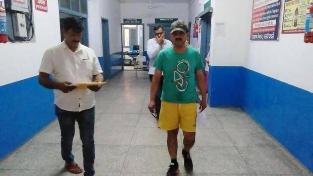 A video of him sporting the casual outfit and talking to the hospital staff without wearing a face also surfaced on the social media. He is also seen taking rounds of the hospital premises in the clip. (HT Photo) A video of him sporting the casual outfit and talking to the hospital staff without wearing a face also surfaced on the social media. He is also seen taking rounds of the hospital premises in the clip. (HT Photo)