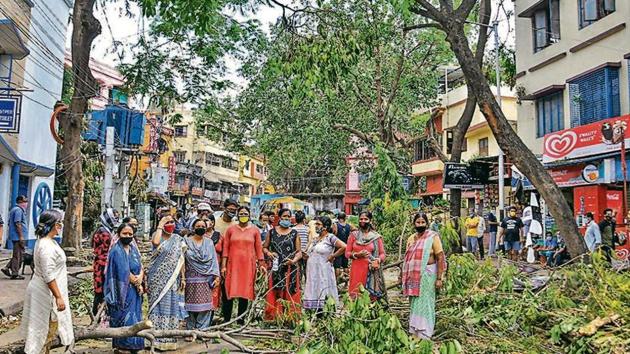 Women protest against the delay in removal of uprooted trees, prolonged power cuts and unavailability of water, in the aftermath of cyclone Amphan, at Bijoygarh in Kolkata on Saturday. (PTI) Women protest against the delay in removal of uprooted trees, prolonged power cuts and unavailability of water, in the aftermath of cyclone Amphan, at Bijoygarh in Kolkata on Saturday. (PTI)