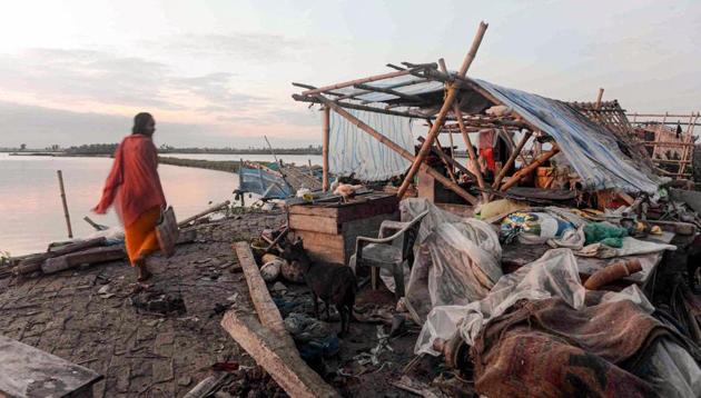 A villager walks past a damaged house, in the aftermath of cyclone Amphan, in South 24 Paraganas district of West Bengal, Friday, May 22, 2020.(PTI photo)