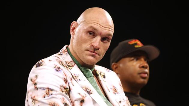 Tyson Fury with trainer Javan Steward during a press conference after the fight.(REUTERS)