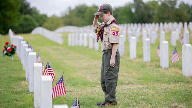Cub Scout Colten Short, 10, of Arlington, salutes a grave after fixing a flag in front of a headstone ahead of the Memorial Day weekend at West Tennessee State Veterans Cemetery in Memphis, Tennessee. Memorial Day is celebrated on the last Monday of May to honour and mourn the military personnel who died while serving in the US armed forces. (Max Gersh/The Commercial Appeal/USA TODAY/REUTERS)